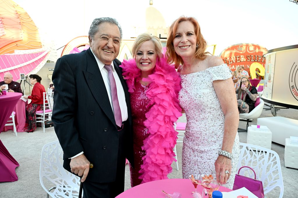 Nelson Sardelli, Emily Conner Cooper and Lorraine Sardelli attend the Flamingo vintage sign lighting ceremony honoring comedian Pat Cooper at The Neon Museum Las Vegas on May 19, 2024 in Las Vegas, Nevada