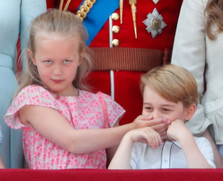 Savannah Phillips clamps a hand over Prince George’s mouth during the 2018 flypast