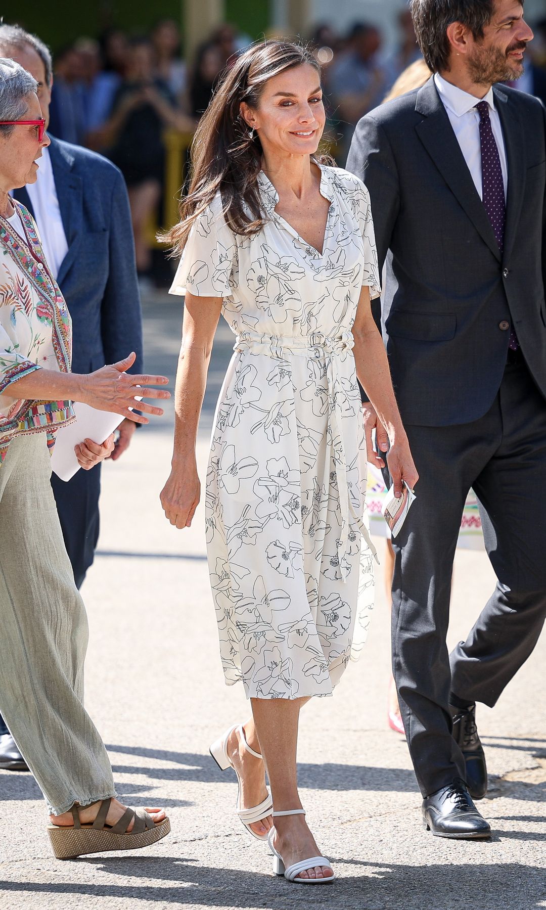 ueen Letizia of Spain attends the inauguration of the Madrid Book Fair 2025 at Retiro Park on May 30, 2025 in Madrid, Spain wearing a white floral print dress